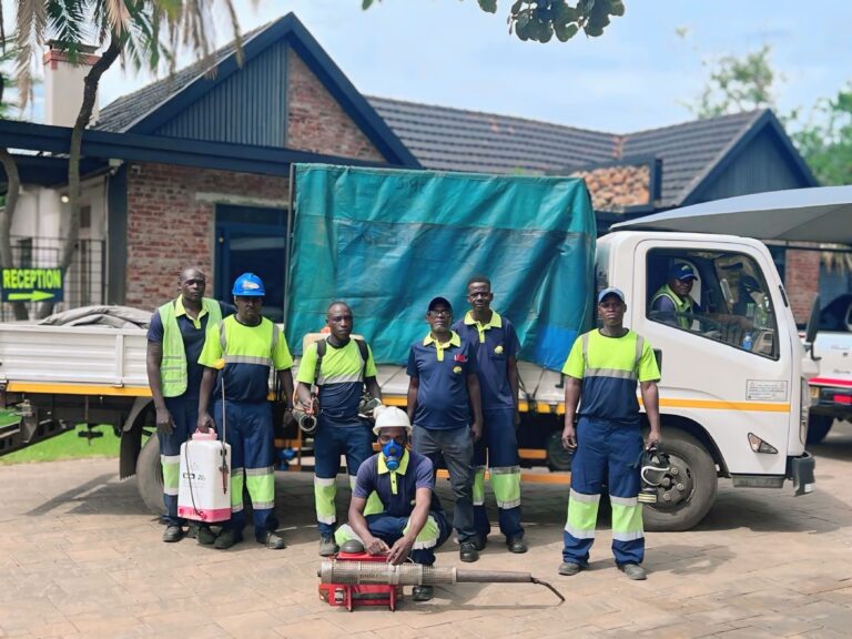The Delports pest control team, highly experienced and equipped with advanced tools such as fogging machines and sprayers, standing in front of their equipment truck, ready to deliver safe and effective pest control solutions. Experienced Delports pest control team in professional uniforms with safety gear, standing in front of their equipment truck, ready to handle pest control tasks using advanced tools like fogging machines and sprayers.